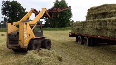 skid steer moving hay|how to rake hay.